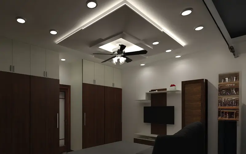 Modern false ceiling design with recessed lighting and a ceiling fan in a contemporary room in chennai