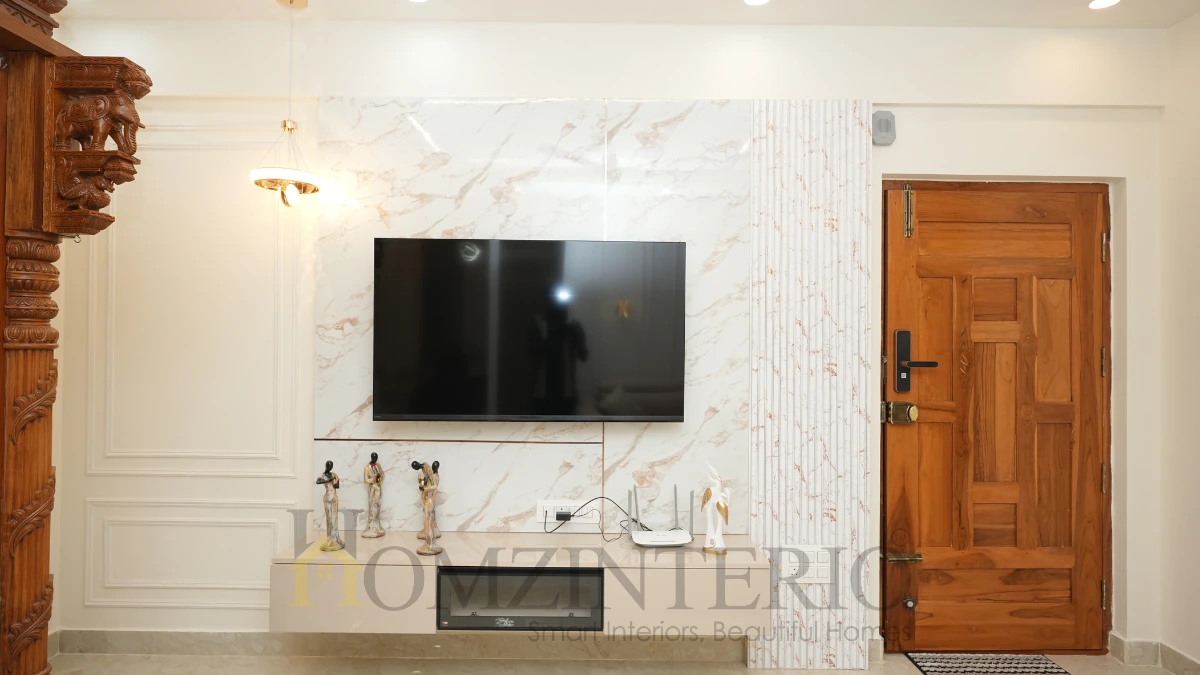 2 BHK home interior design featuring a modern TV unit with marble wall panel