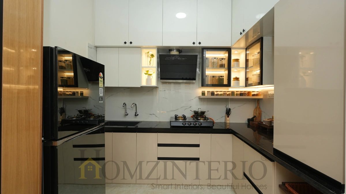 Premium modular kitchen interior featuring L-shaped layout, LED lighting and sleek cabinetry