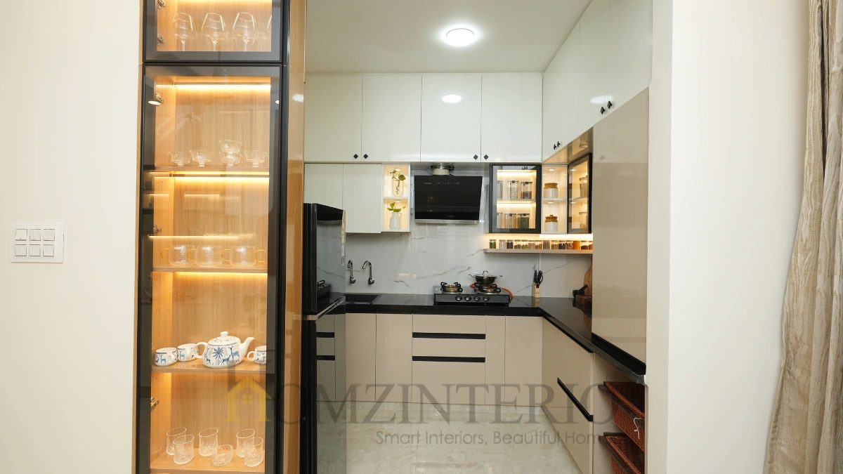 Space-saving modular kitchen design with integrated crockery display and premium finishes